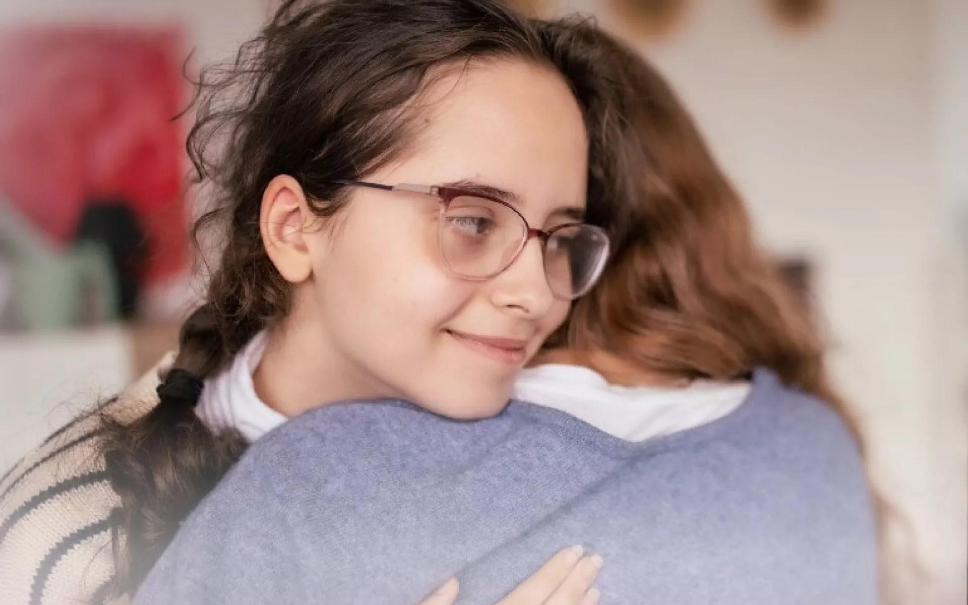 former homeless youth giving each other a hug | Covenant House - Be an Angel Day