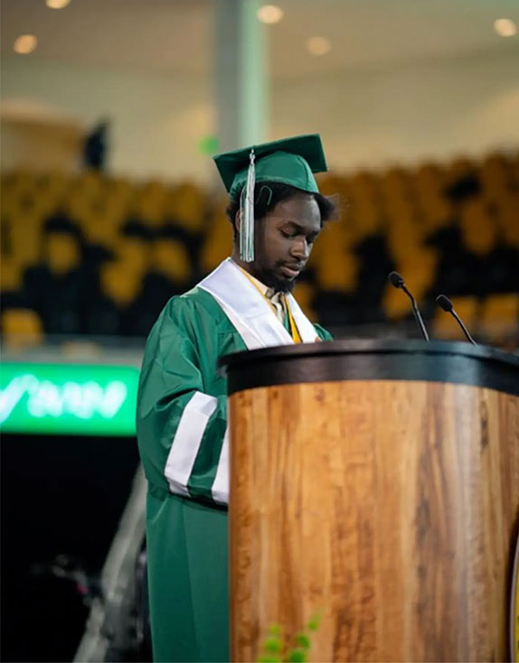 Former homeless teen and high school graduate Elijah at graduation