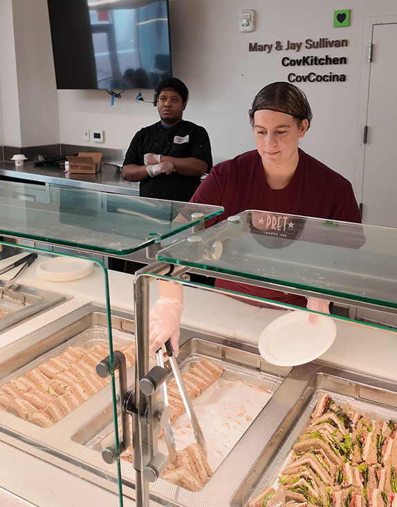 Covenant House Volunteers serving meals to homeless kids