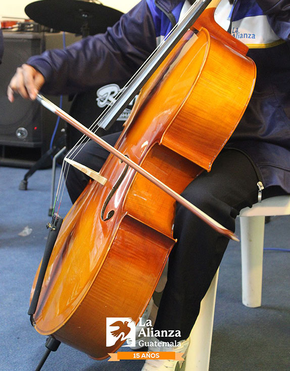 Covenant House Guatemala homeless youth playing viola