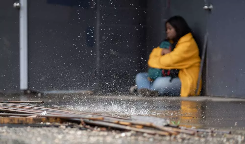 homeless youth trying to take shelter from rain | Covenant House