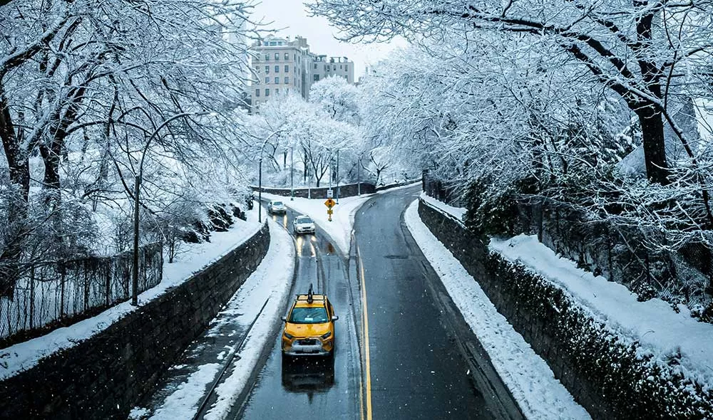 yellow taxi on the road in NYC during the winter | Covenant House