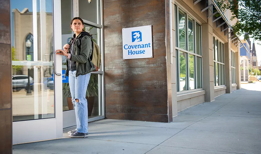 young homeless woman entering Covenant House