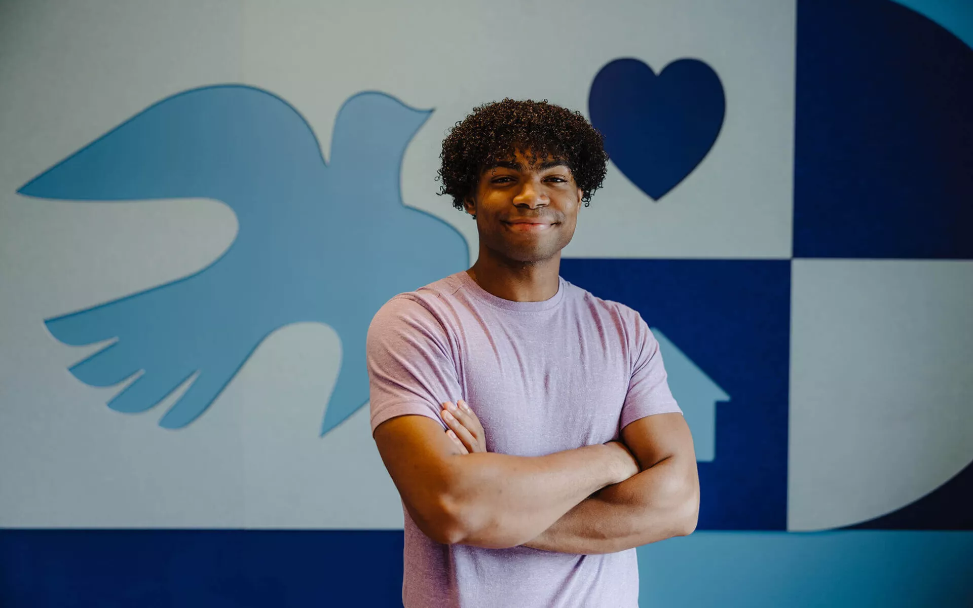 Young man smiling for the camera at Covenant House