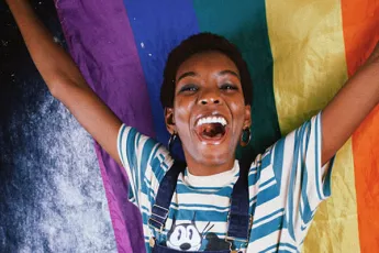 Woman holding a pride flag