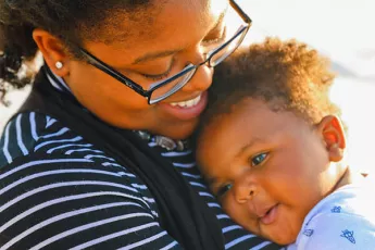 Young mother holding her baby