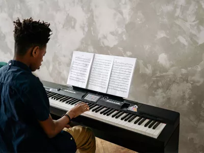 former homeless teen playing piano | Music Therapy at Covenant House
