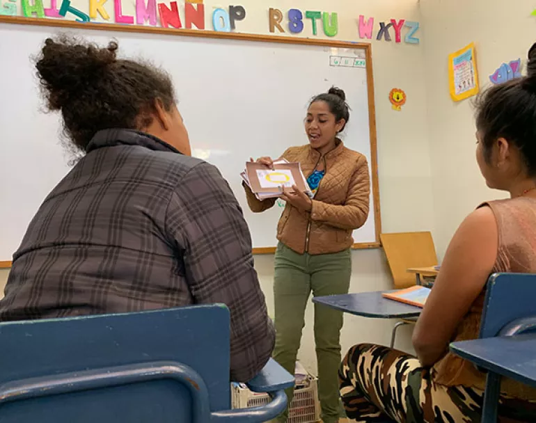 Teacher teaching youth in classroom - Covenant House Latin America