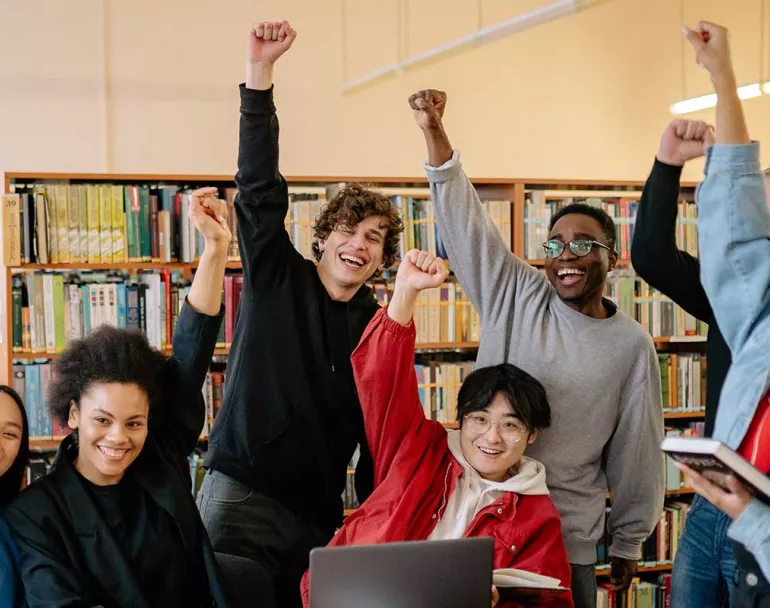 group of happy former homeless youth | Covenant House