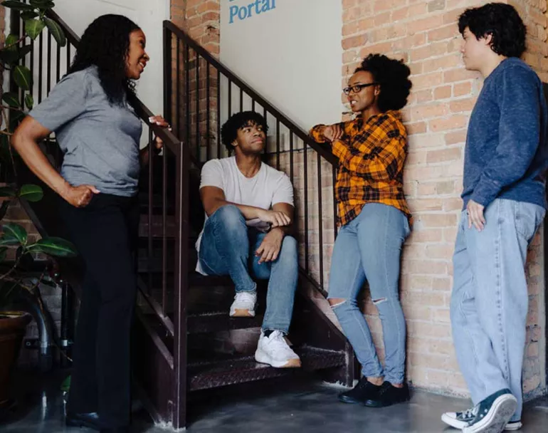 Covenant House previously homeless teens having a conversation inside shelter