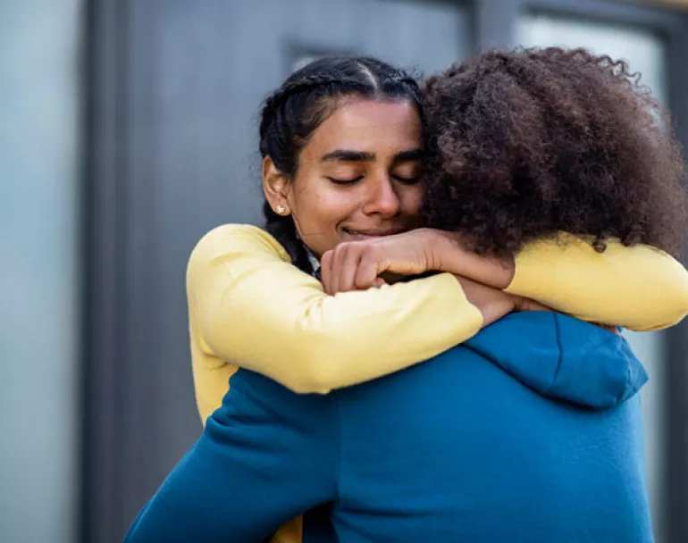 former homeless teen girls hugging | Covenant House - Donate Now to help homeless youth